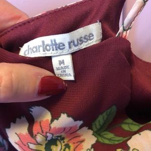 CHARLOTTE RUSSE medium dress. Short sleeves with holes in the top of shoulder.